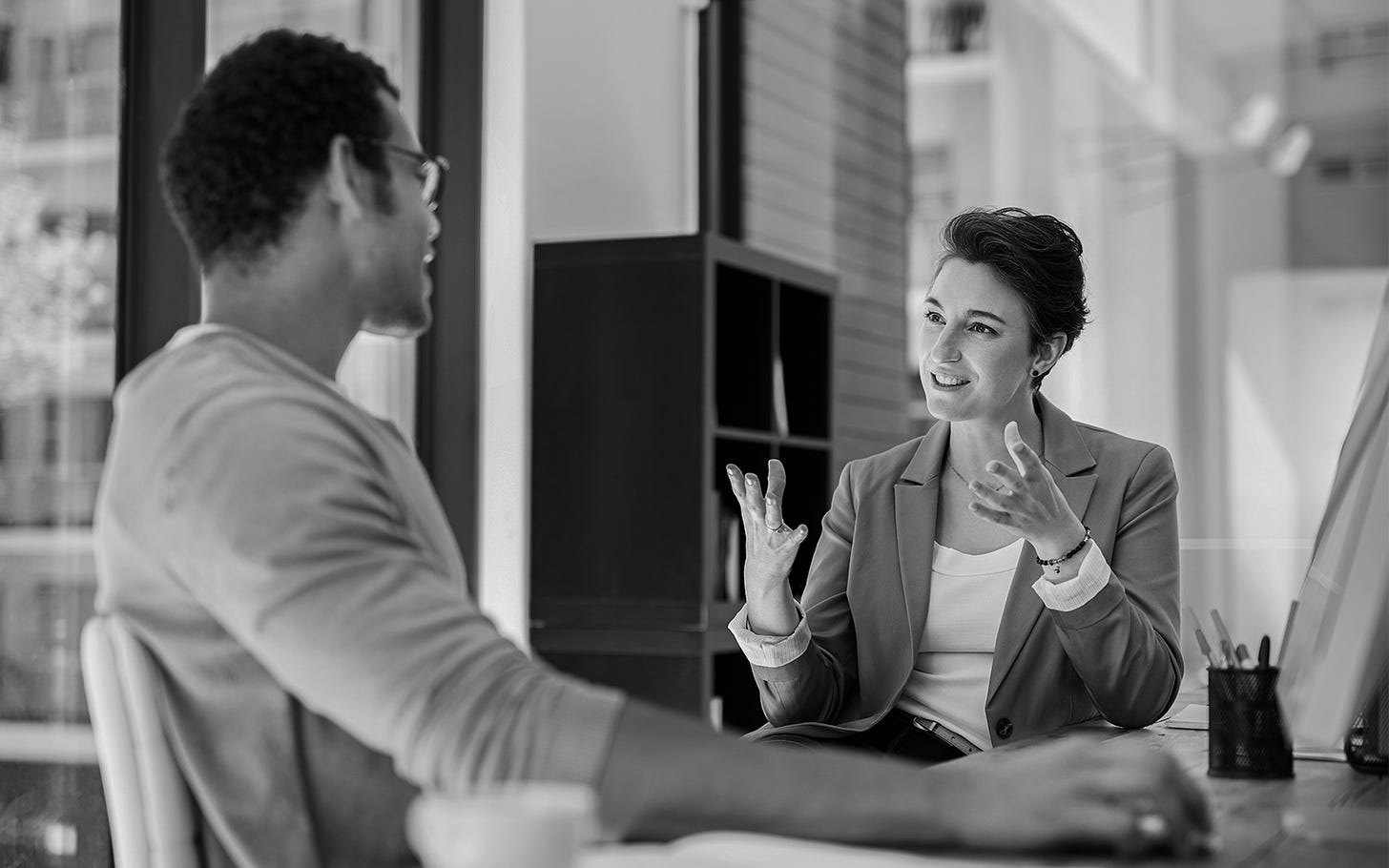 Woman engages another person in conversation using her hands all the way