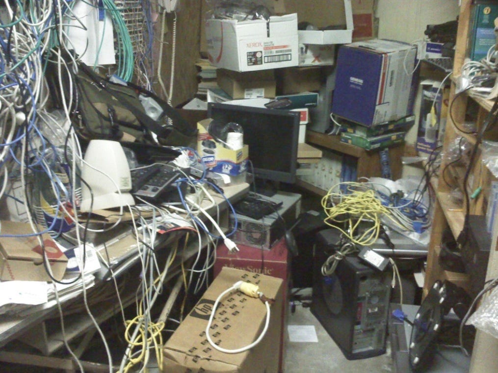 A typical computer room in the 00s with messy cables.