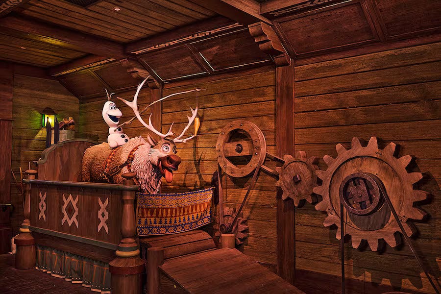 Olaf and Sven send guests off on the lift hill of Wandering Oaken’s Sliding Sleighs.