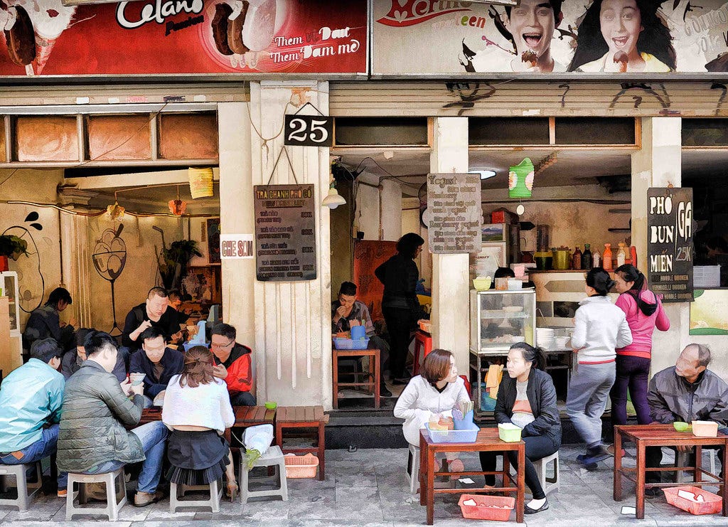 One of my favourite photo's of the holiday. There is so much going on in this little cafe scene with lots of different local characters.