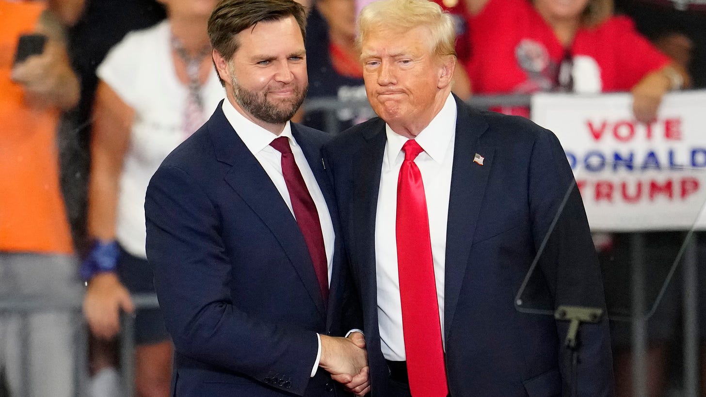 FILE - Republican vice presidential candidate Sen. JD Vance, R-Ohio, left, and Republican presidential candidate former President Donald Trump, shake hands at a campaign rally in Atlanta, Aug. 3, 2024. (AP Photo/Ben Gray, File)