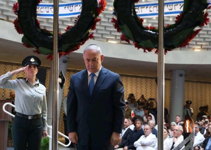 Israeli Prime Minister Benjamin Netanyahu lays a wreath during the state memorial ceremony for the fallen soldiers of the 1973 October (Yom Kippur) War, at the Hall of Remembrance on Mt. Herzl in Jerusalem on 10 October 2019. [GALI TIBBON/AFP via Getty Images]