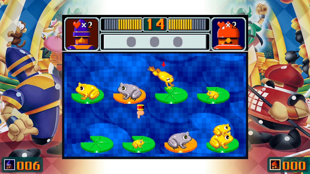 A screenshot of the frog and lily pad puzzle from the Sega Ages edition of Ichidant-R. A number of golden frogs need to be placed on the golden lily pad, but grey frogs are in the way. Larger frogs can not be placed on top of smaller frogs, but you can stack from largest to smallest.