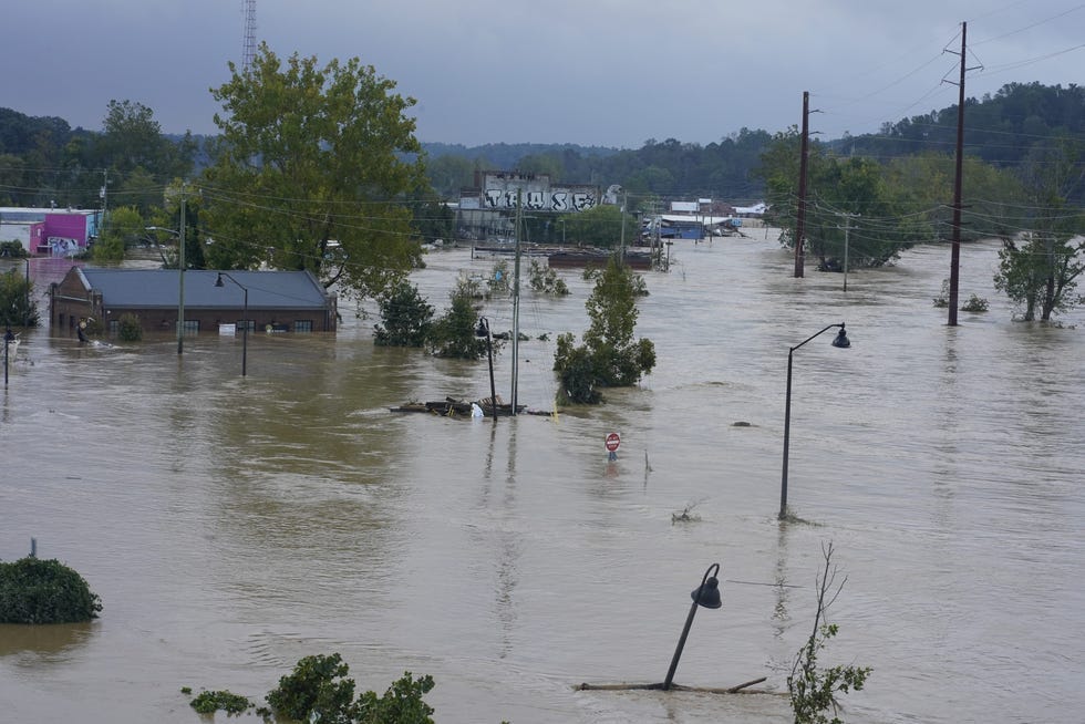 Flood waters from the French Broad River cover the River Arts District in Asheville, North Carolina on Saturday, September 28, 2024.