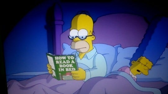 Homer being Homer.. How to read a book in bed. Love the specs! 👓 –  @titanblue2 on Tumblr