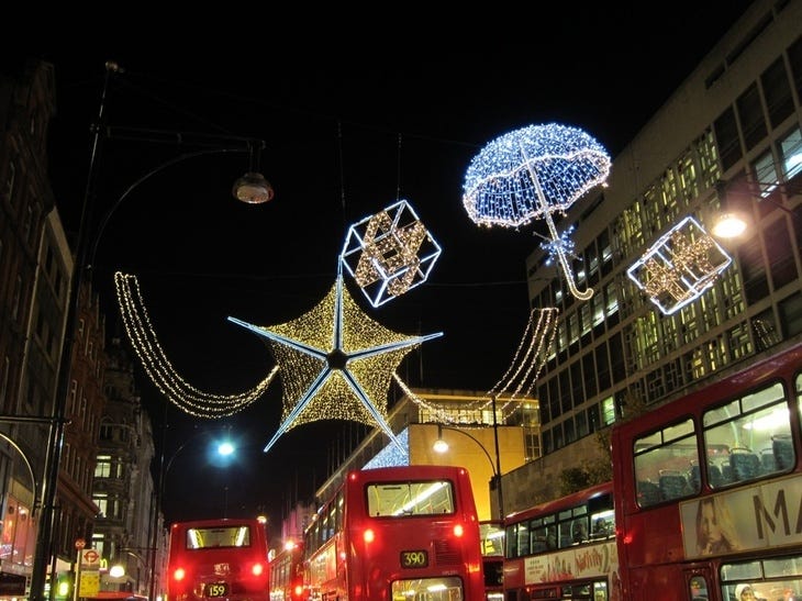 Christmas lights above Oxford Street. shaped like stars, presents and umbrellas