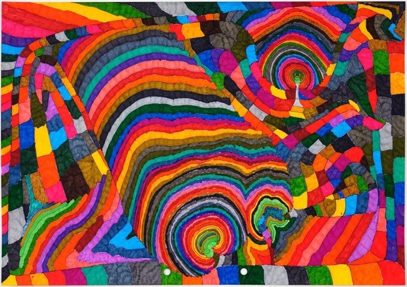 Artwork by Susan Te Kahurangi King, an autistic artist from NZ. This art is in many colours, intricately drawn and coloured with felt tip pens, layers of shapes in a riot of colour and shapes nestled into each other. There is no white space!