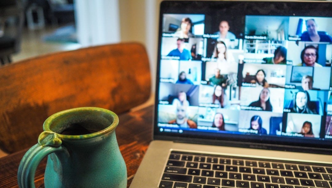 macbook pro displaying group of people