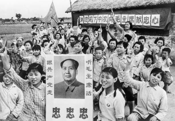 People of Hungching celebrate the 10th anniversary of the establishment of people's communes, holding Mao's "Little Red Book", on September 1968. -...