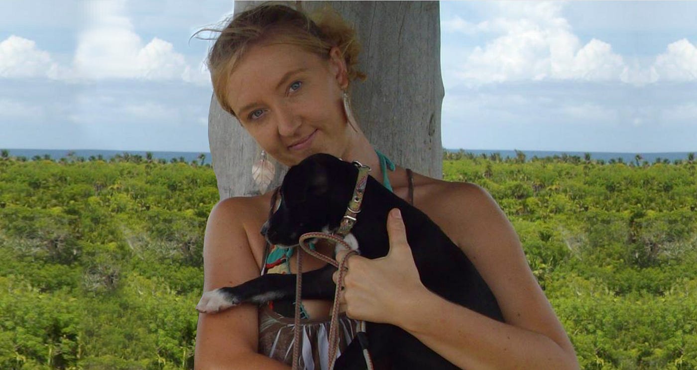 Picture of me in Mexico holding my dog when she was a tiny puppy