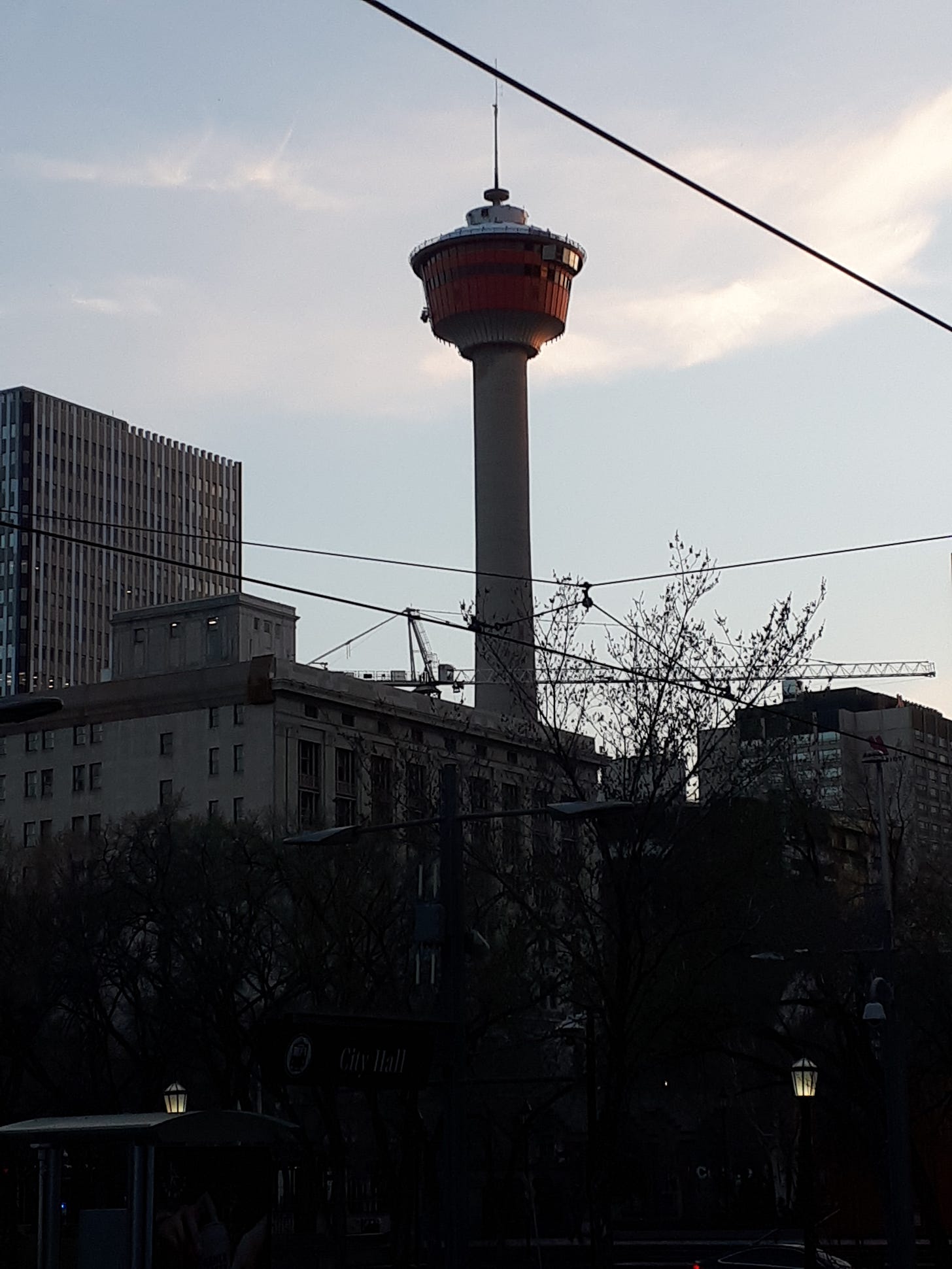 The Calgary Tower with downtown buildings in the foreground.