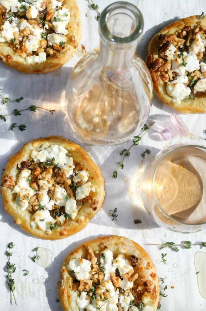 goat cheese tarts and a bottle of rosé