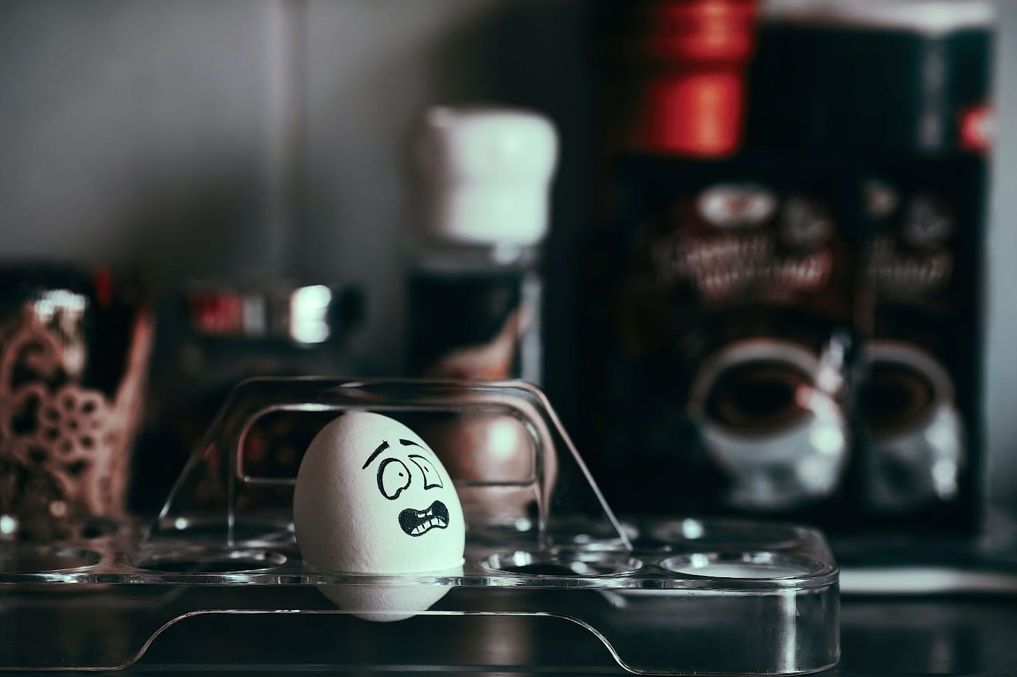An anxious-looking face is painted on an egg.