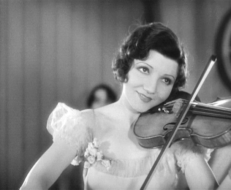 Claudette Colbert, the most beautiful angel to ever hold a violin, in a scene from The Smiling Lieutenant