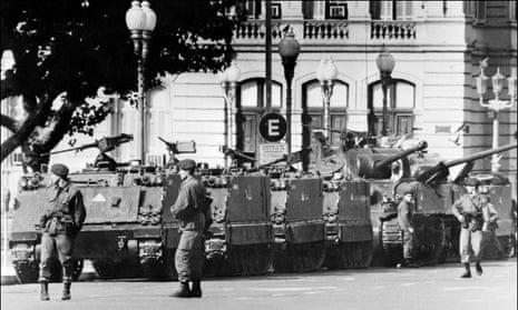 Tanks and soldiers stand in front of Argentina's presidential palace