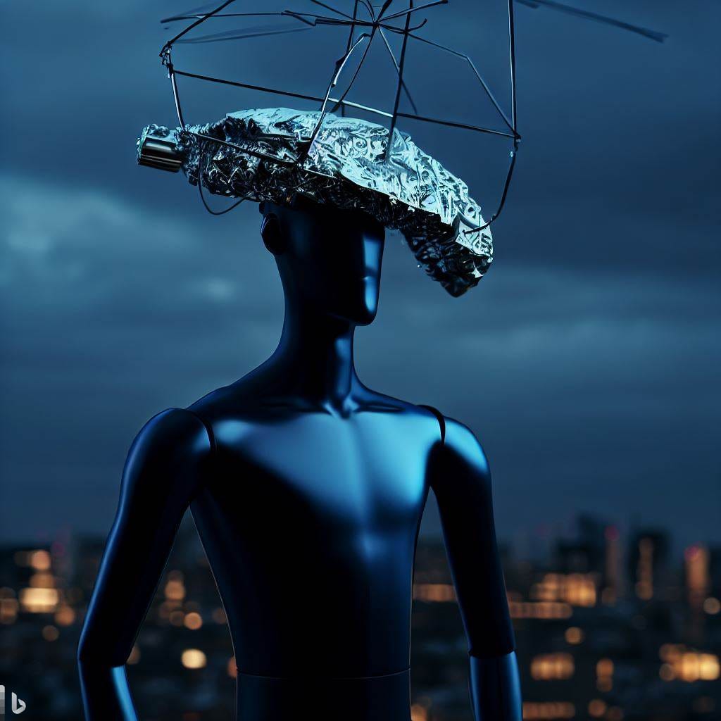 a dark blue male mannequin wearing a scrunchy tinfoil hat and holding an antenna like an umbrella. A large city urban background at dusk.
