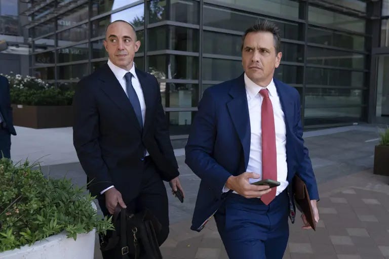 Former President Donald Trump attorneys Emil Bove, left, and Todd Blanche leave the U.S. federal courthouse in Washington after a 2024 hearing.