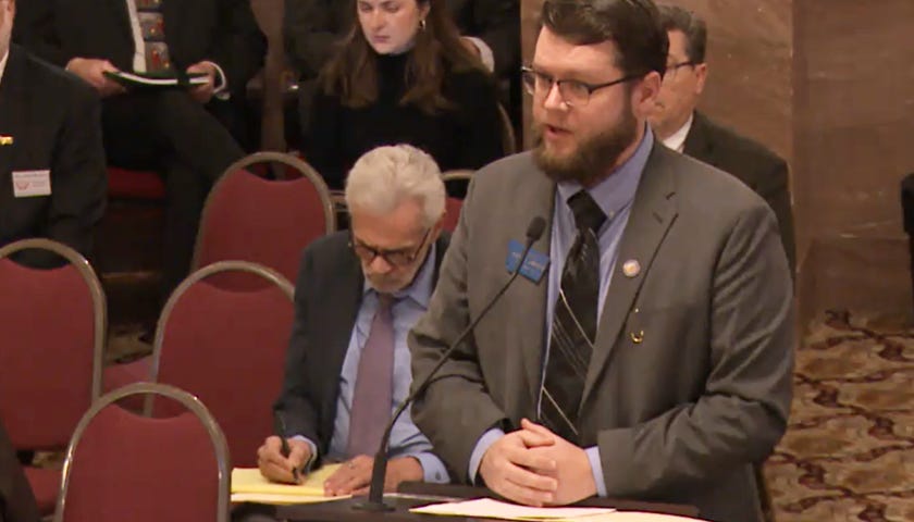 Emrich speaking at hearing