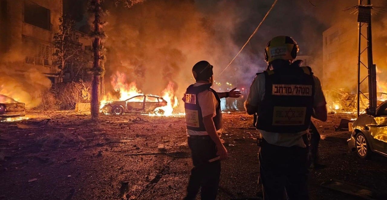 Emergency personnel work the scene after a missile launched from Iran struck Haifa, Israel, on Sunday. Emergency personnel work the scene after a missile launched from Iran struck Haifa, Israel, on Sunday.