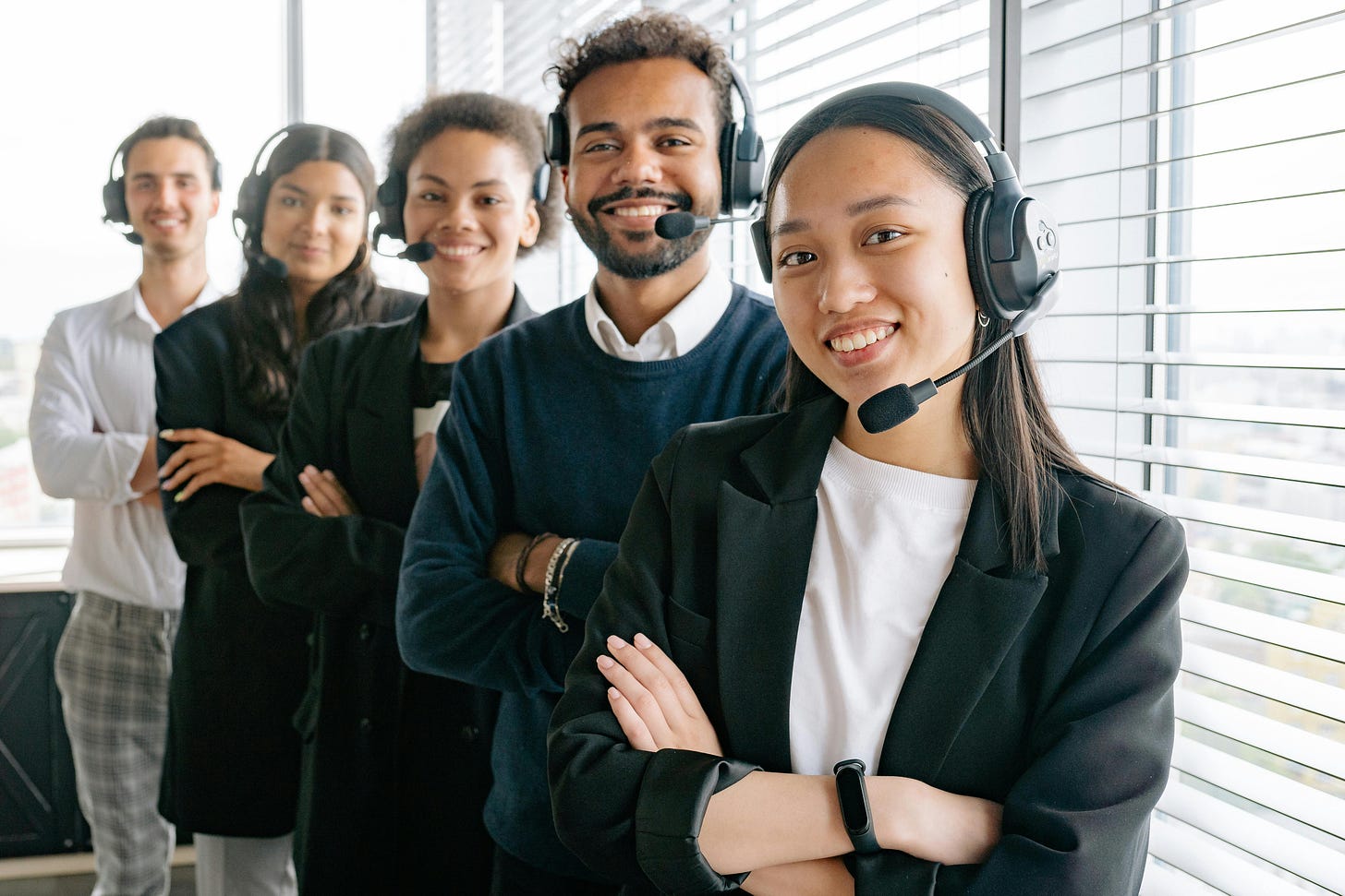 A team of people with phone headsets