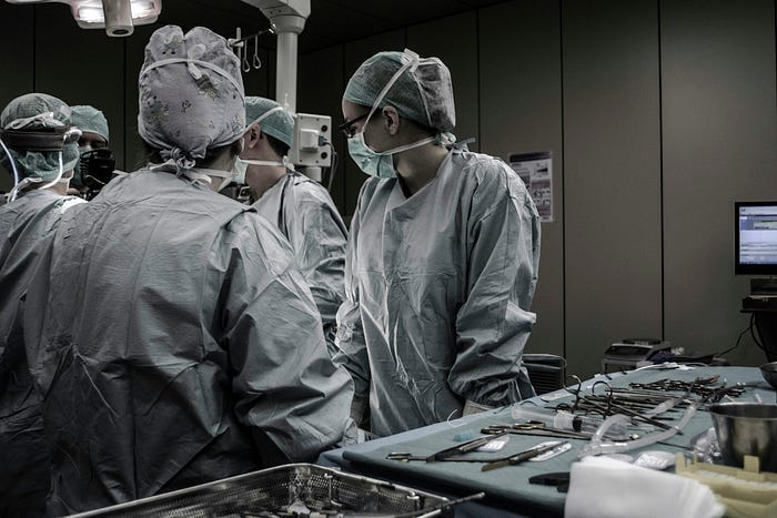 Doctors and Nurses in Surgery, operating theatre.