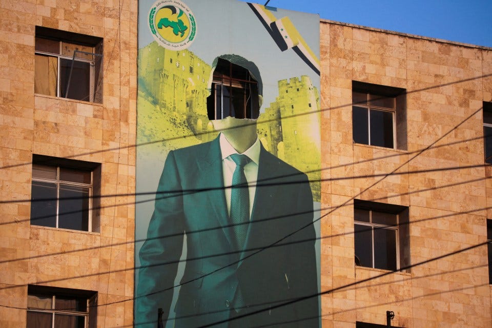 A poster of Assad with his face torn out