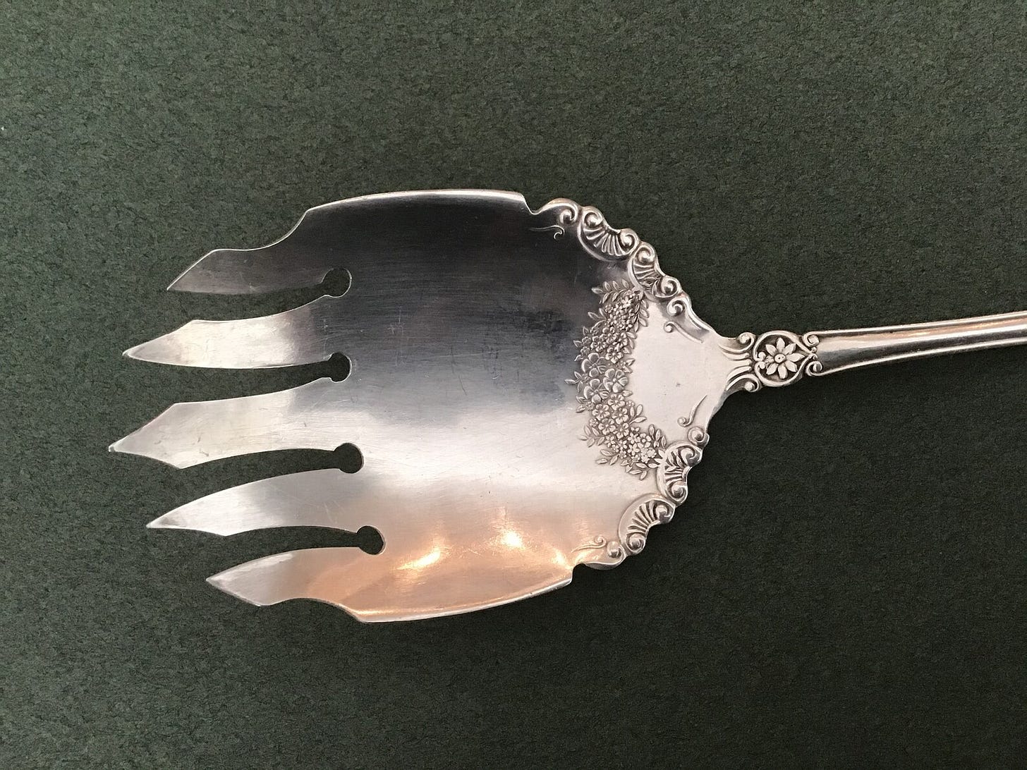 salad serving fork with floral detail.
