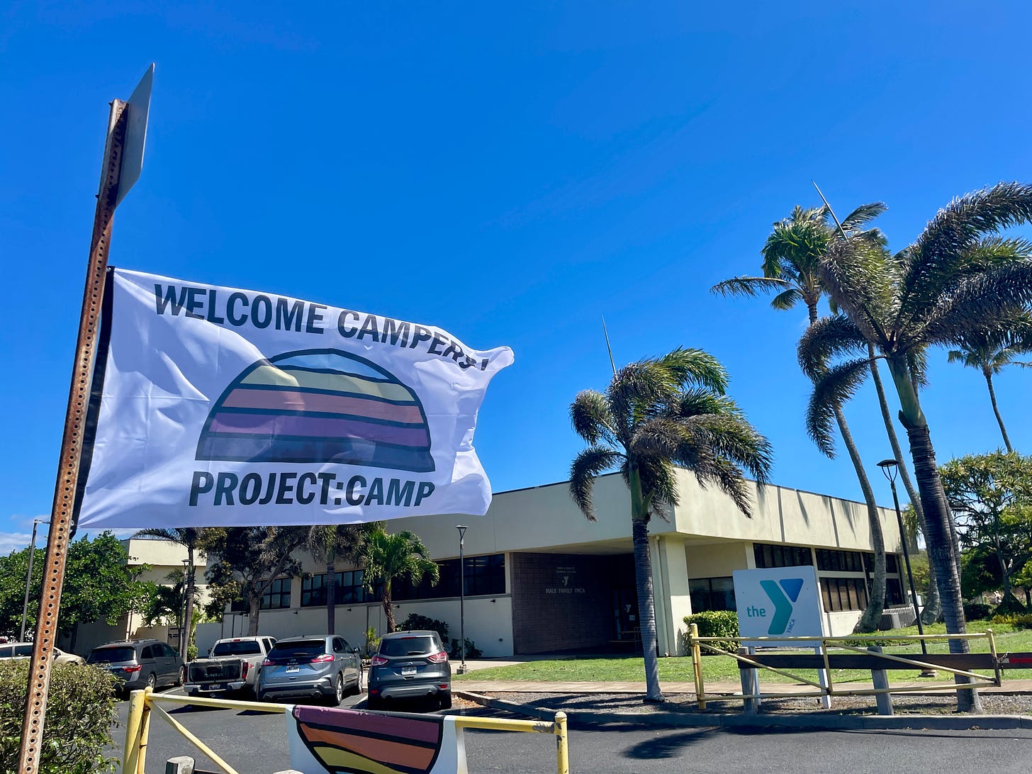 Project:Camp flag "Welcome Campers!" blowing in the wind on Maui