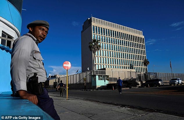 Beijing is building an electronic eavesdropping facility on Cuba, just 100 miles from the coast of Florida, that will be able to gather US military secrets. Pictured: A police officer stands guard across the street from the US embassy in Havana on May 26, 2023