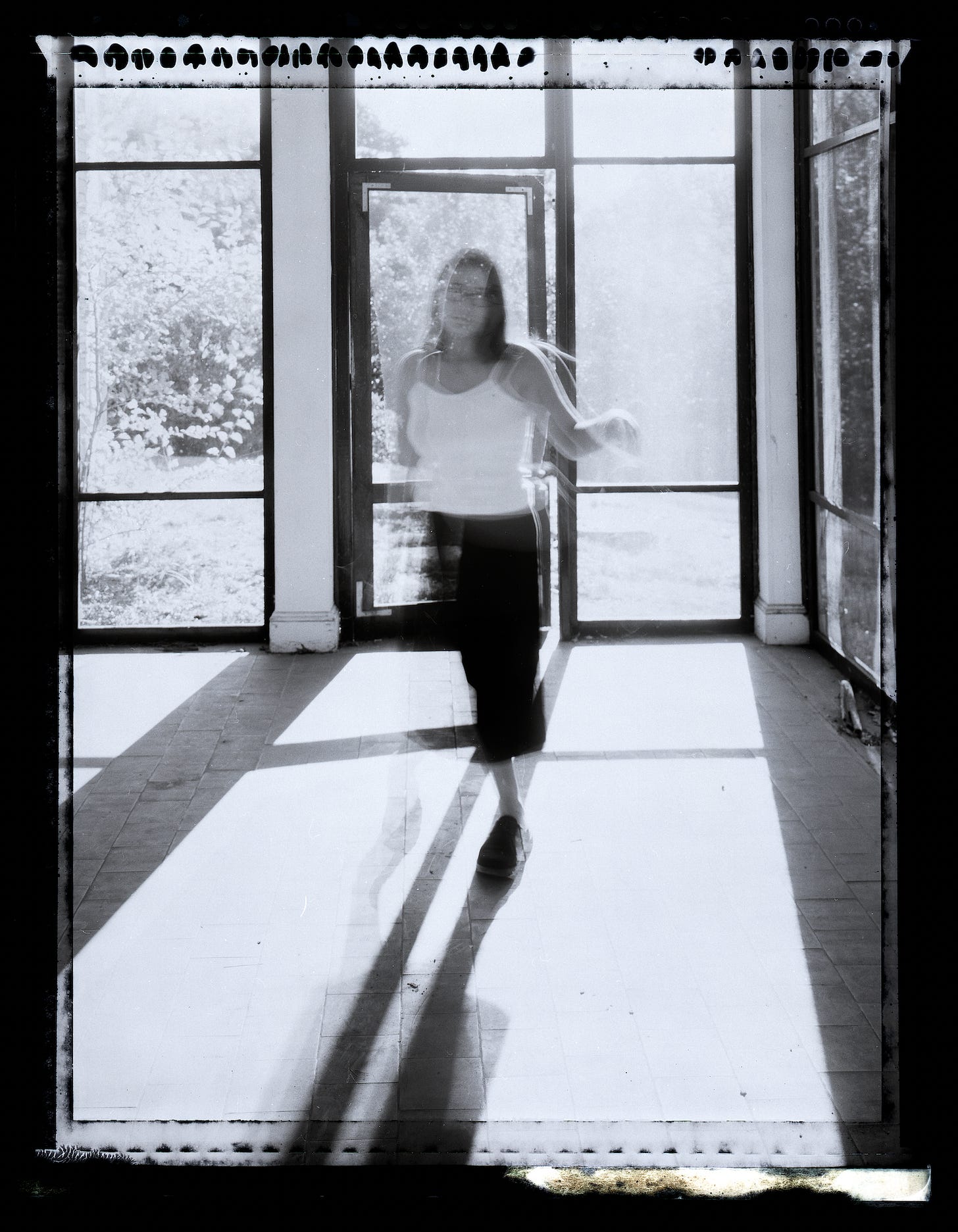 Owen Muir's photo of a girl in a screened in porch