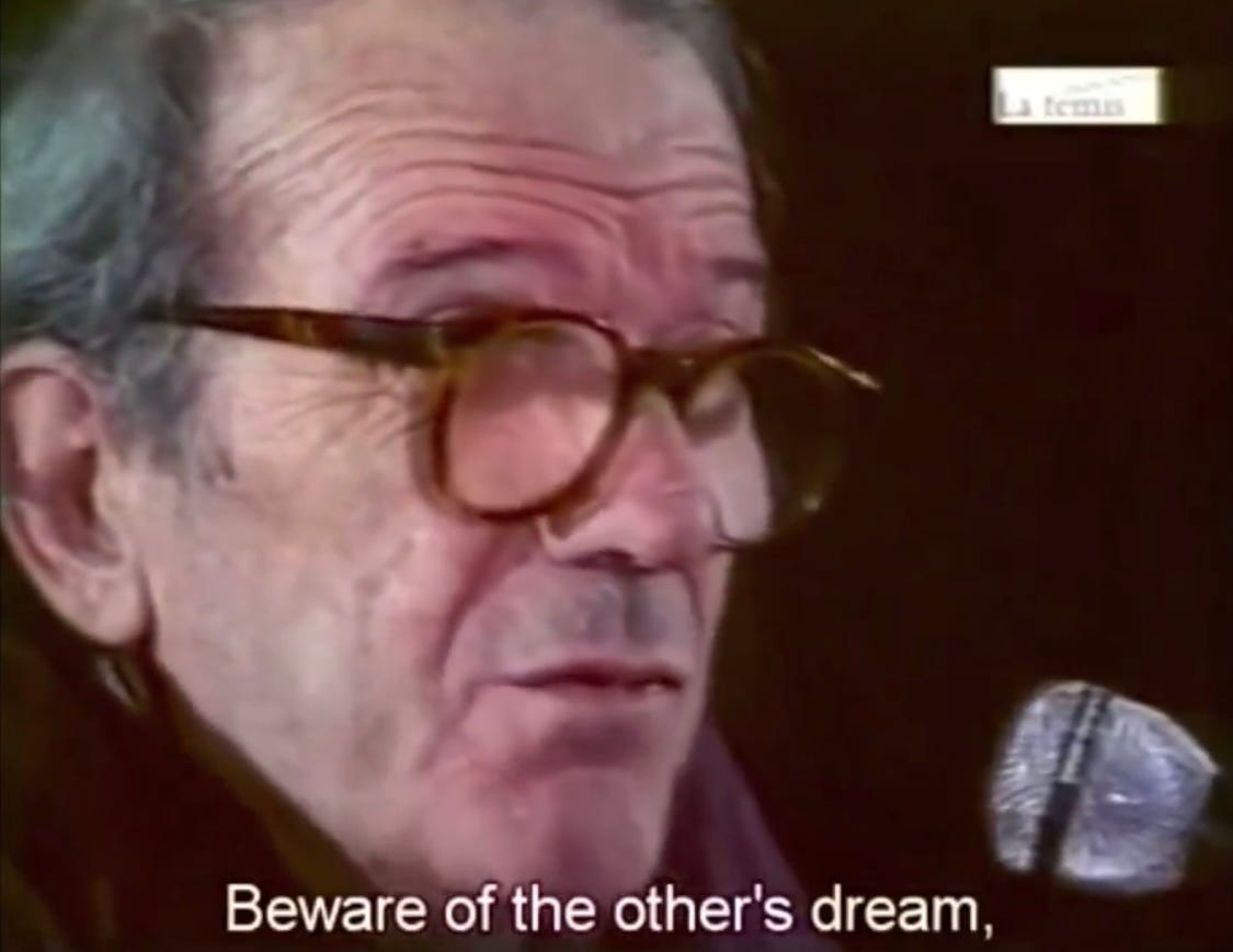 An older whit eman in thick rimmed glasses--Gilles Deleuze--is speaking into a microphone and there is a caption that says Beware of the other's dream.