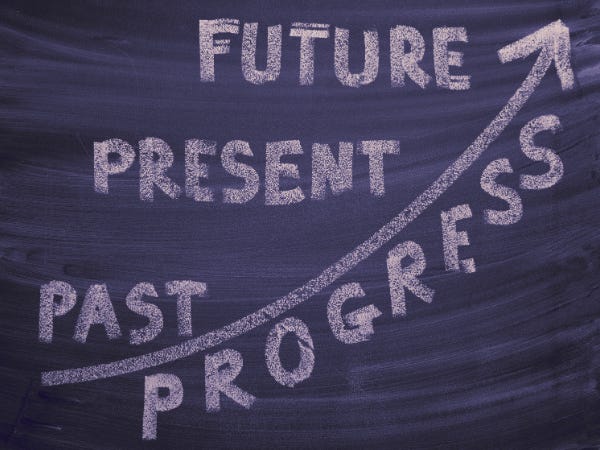 chalkboard with an arrow called progress going up to the right, past, present, and future rise with the arrow