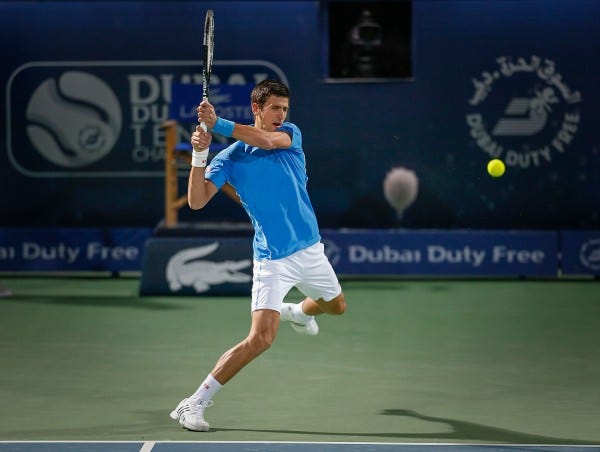 novak djokovic takes out borna coric atp dubai tennis 2015 images