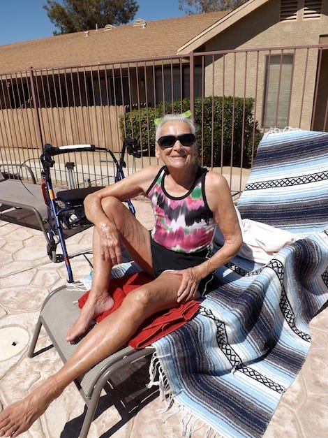 Photograph by Sherry Killam Arts of 92 year old woman lounging at a pool.