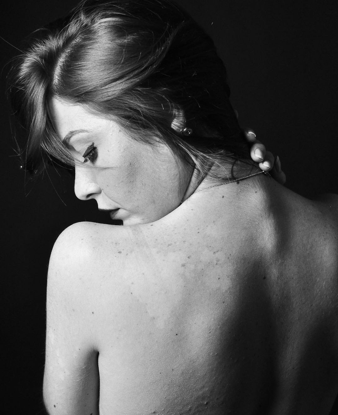 grayscale photo of topless woman