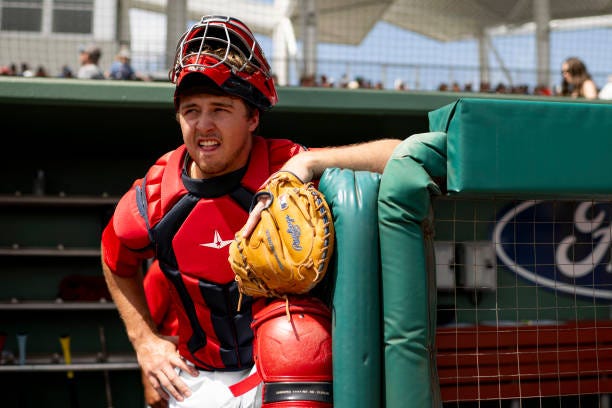 Kyle Teel of the Boston Red Sox looks on before taking the field for the Spring Breakout game against the Atlanta Braves at JetBlue Park at Fenway...