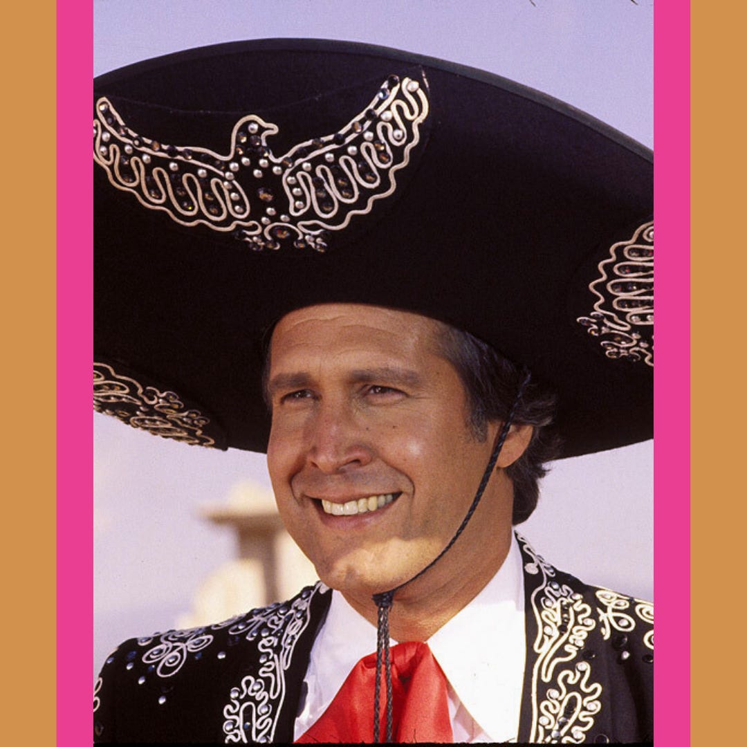 Chevy Chase smiling awkwardly in mariachi costume in The Three Amigos movie.