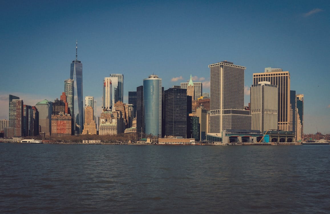 Free Stunning view of New York City's skyline across the water featuring iconic skyscrapers. Stock Photo