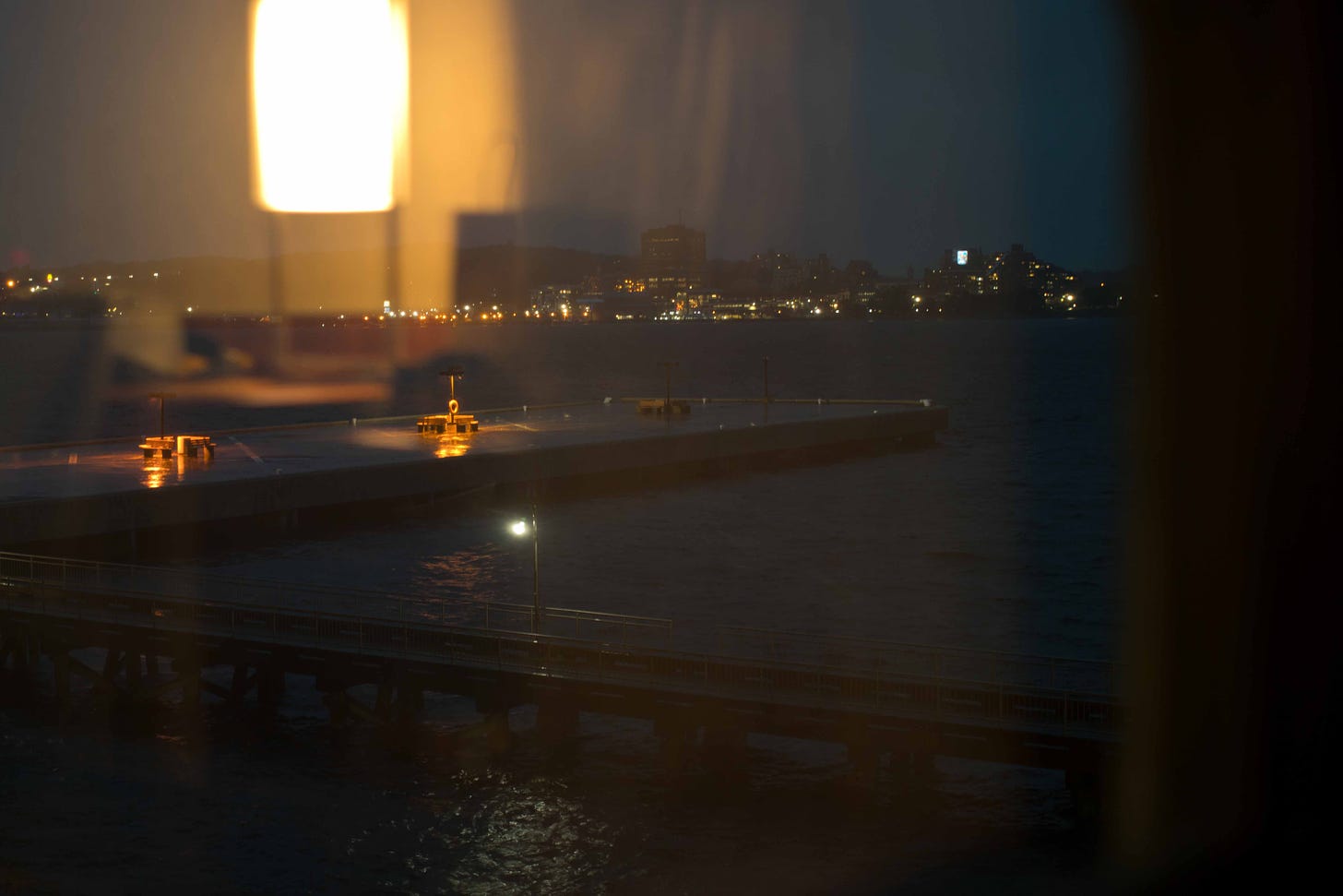 Reflection of hotel lamp in window during Hurricane Fiona hitting the Halifax Harbour. September 2022. Photo credit: Nancy Forde