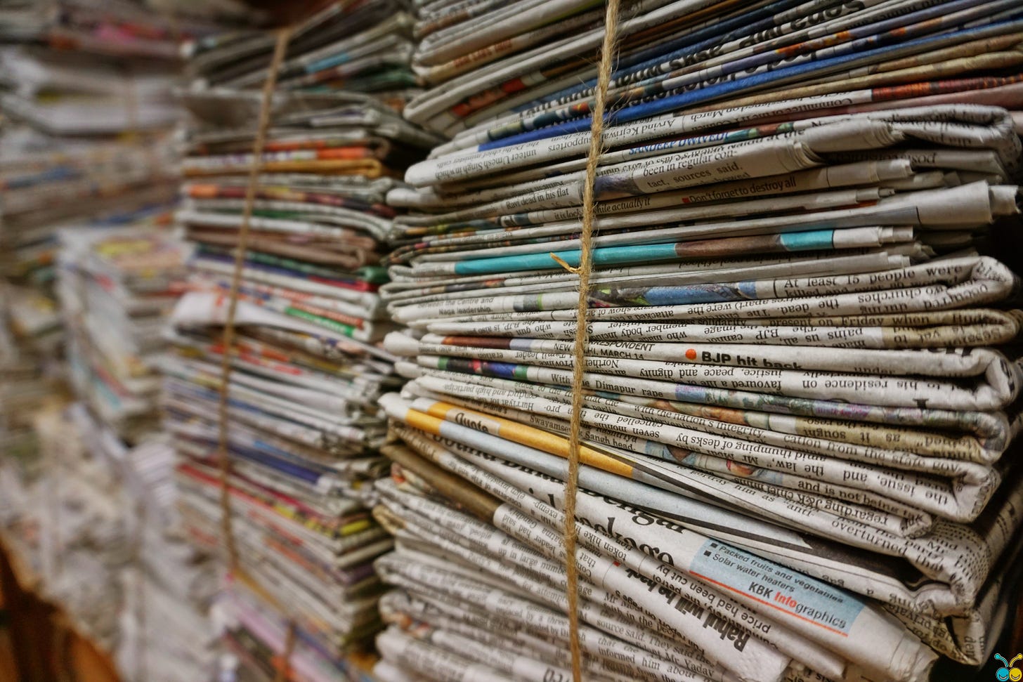 Tall stacks of newspapers