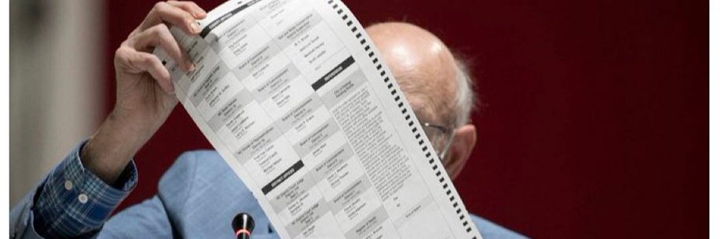 Gerry Cohen looking at a ballot VERY closely Gerry Cohen looking at a ballot VERY closely