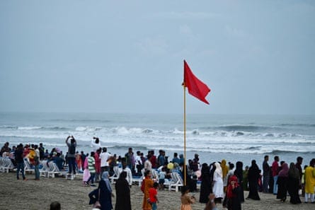 A red flag flutters on a Cox’s Bazar beach as a warning for the coming cyclone