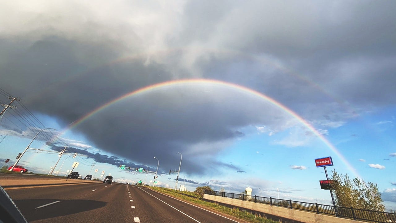 double rainbow over highway