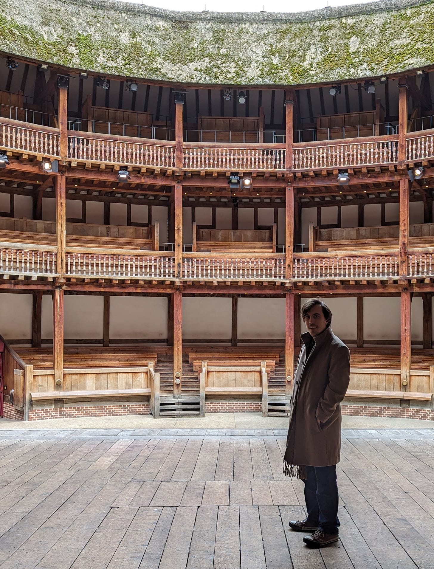 Felix standing on the stage at Shakespeare's Globe.