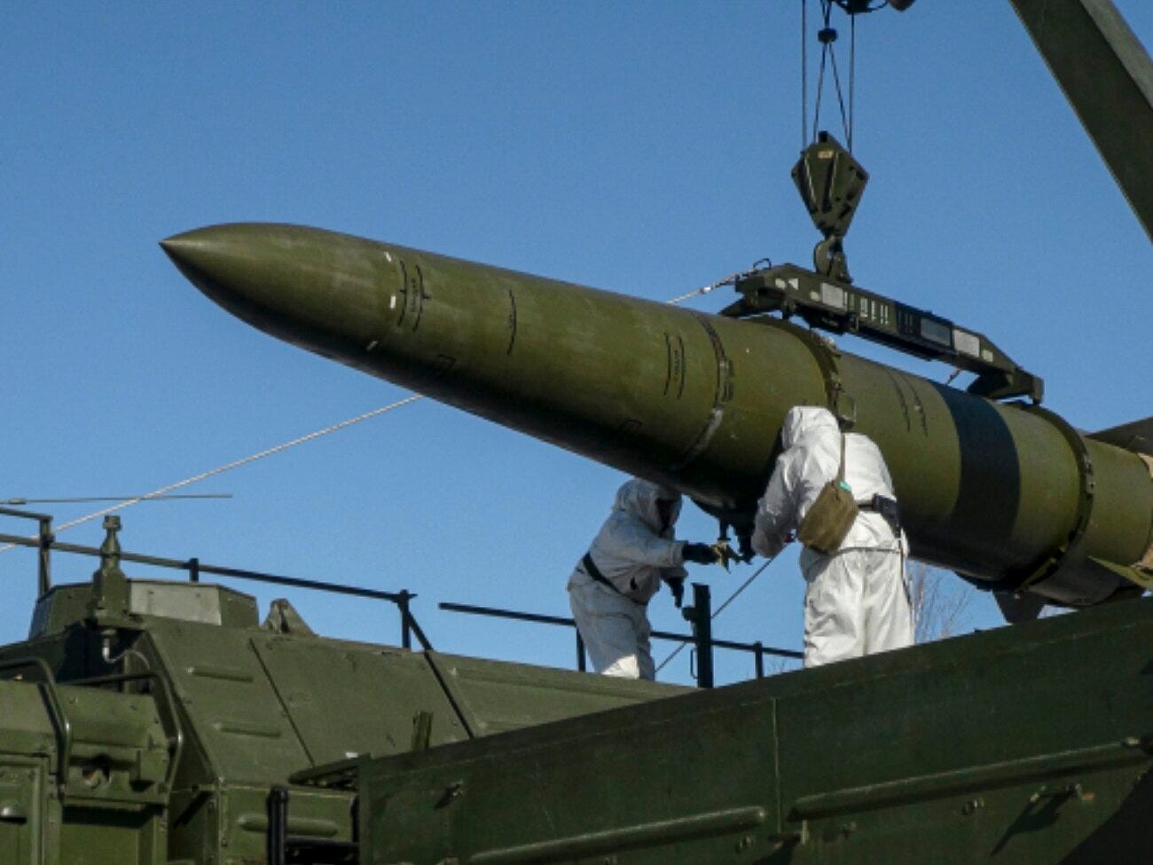 In this photo released by Russian Defense Ministry Press Service on Friday, Feb. 2, 2024, Russian troops load an Iskander missile onto a mobile launcher during drills at an undisclosed location in Russia.