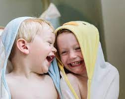 Two Family Brother Sister Children Laughing Together In Bath Towels" by  Stocksy Contributor "Raymond Forbes LLC" - Stocksy