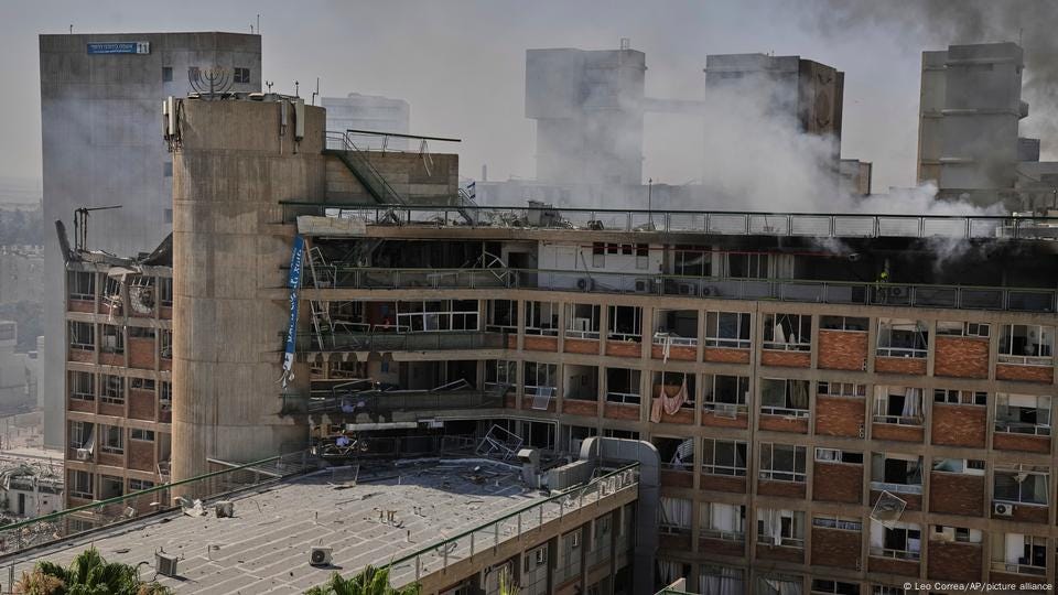 Smoke rises from a building of the Soroka hospital complex after it was hit by a missile fired from Iran Smoke rises from a building of the Soroka hospital complex after it was hit by a missile fired from Iran