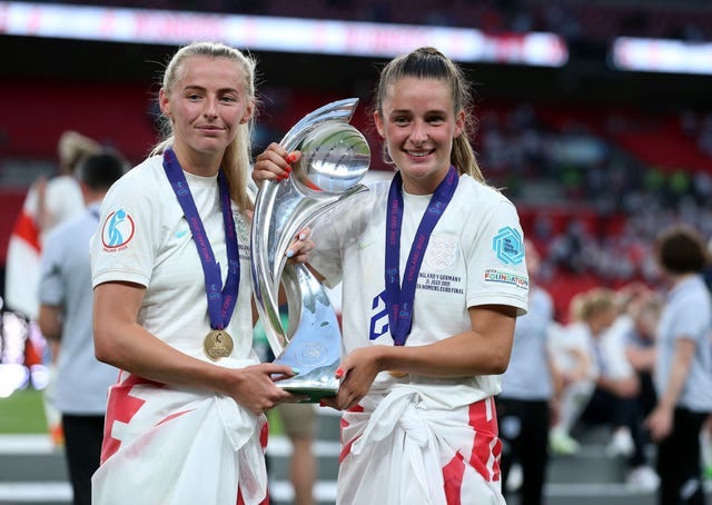 Kelly (left) and Ella Toone with the trophy after England's Euros triumph (Nigel French/PA)