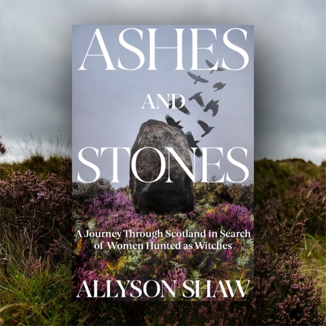 Image of a book with a standing stone and crows in heather, floating over a field of heather. The title of the book is Ashes and Stones: a journey through Scotland in search of women hunted as witches.