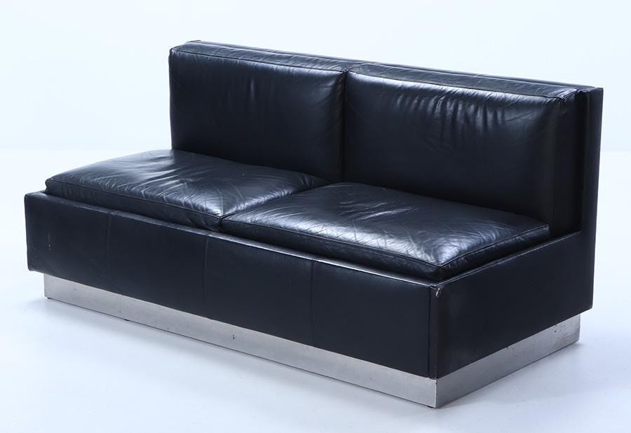 FRENCH BLACK LEATHER SOFA C 1970 WITH STEEL COVERED BASE.